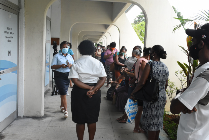 A long line of people along the verandah of Oceangate House waiting to go in the Employment Services office yesterday (Photo: Louis Toussaint)